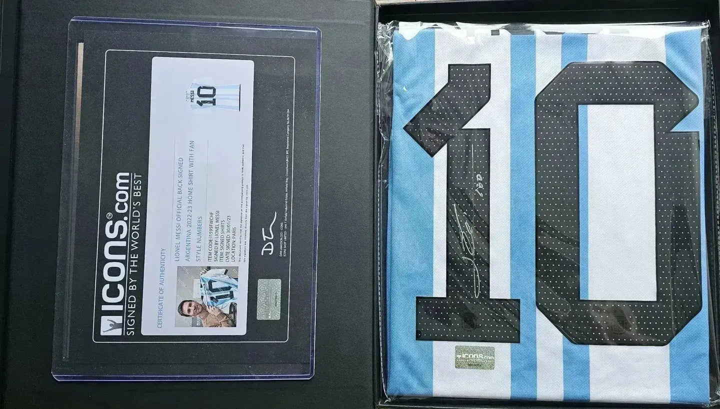Close-up view of the No. 10 on a signed soccer jersey with blue and white stripes and signature.