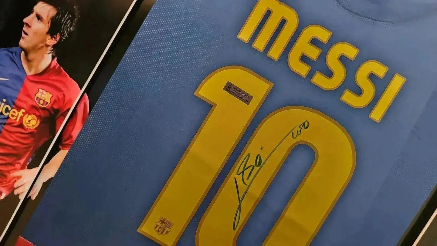 Blue soccer jersey featuring Messi with No. 10 and a prominent signature.