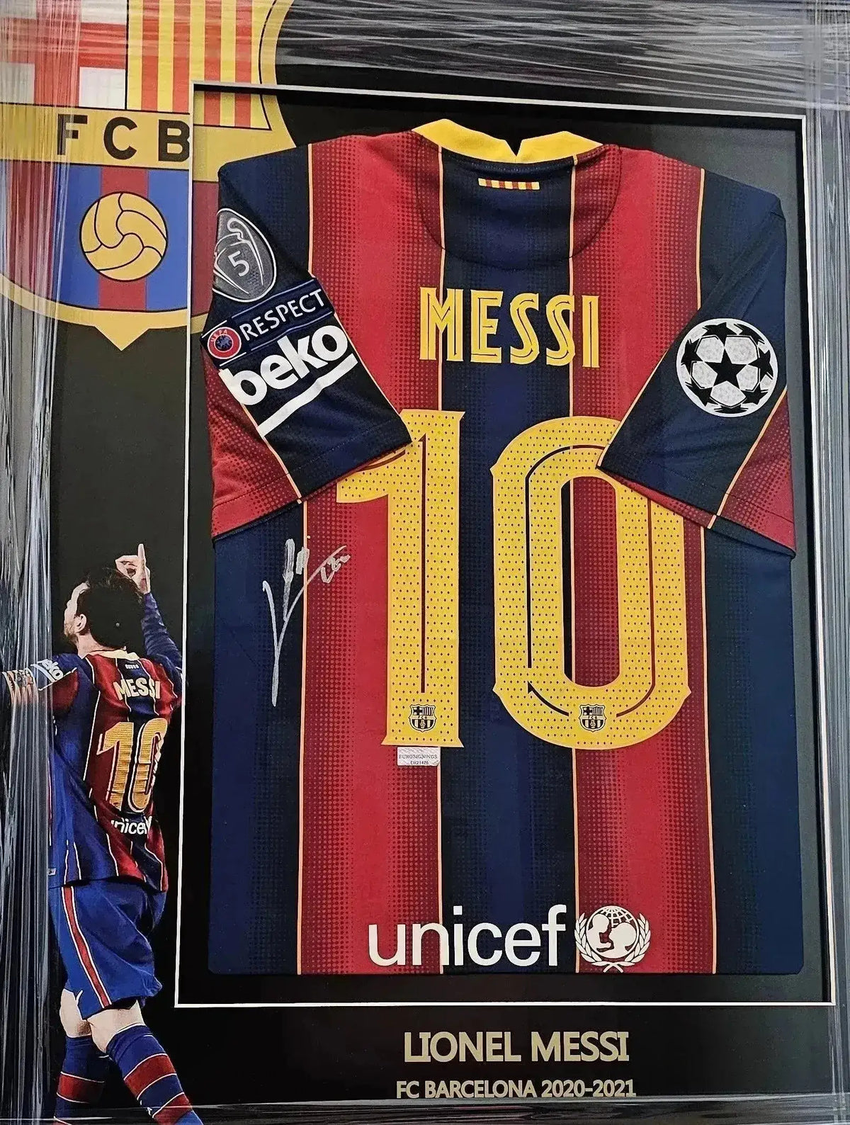 Back view showing No. 10, name 'MESSI', and signature on FC Barcelona 2020-2021 soccer jersey.
