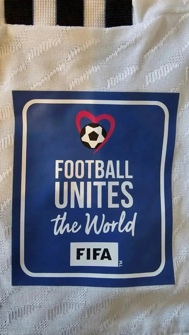 Detail showing FIFA tag with text: FOOTBALL UNITES the World.