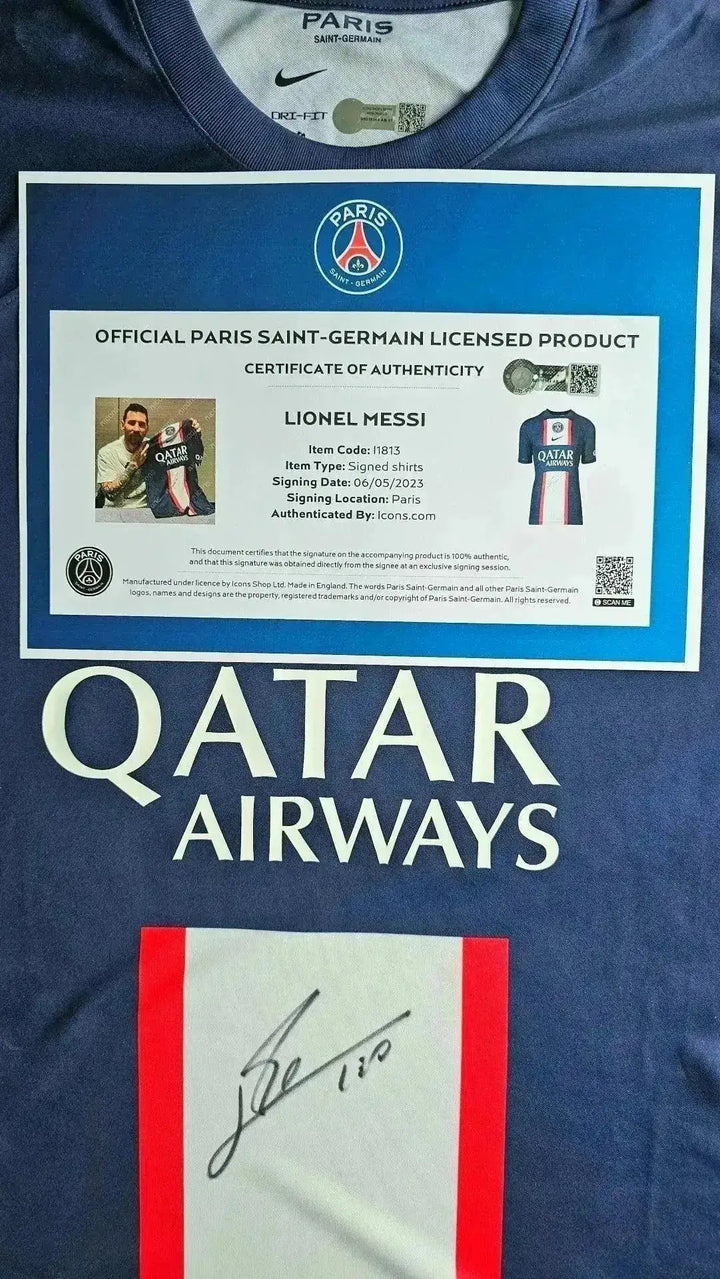 Front view of signed soccer jersey featuring Lionel Messi, PSG crest, and Qatar Airways sponsor.