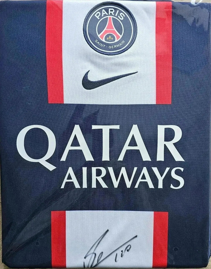 Front view of signed PSG soccer jersey featuring the crest and Qatar Airways sponsor.