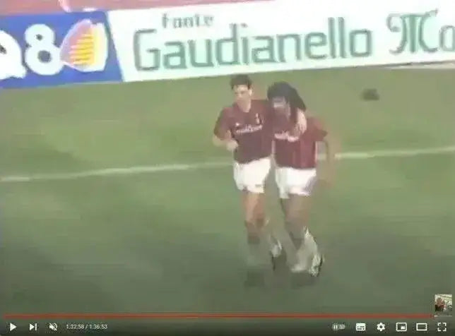 Front view of Marco van Basten 9 AC Milan football shirt, featuring red and black stripes.