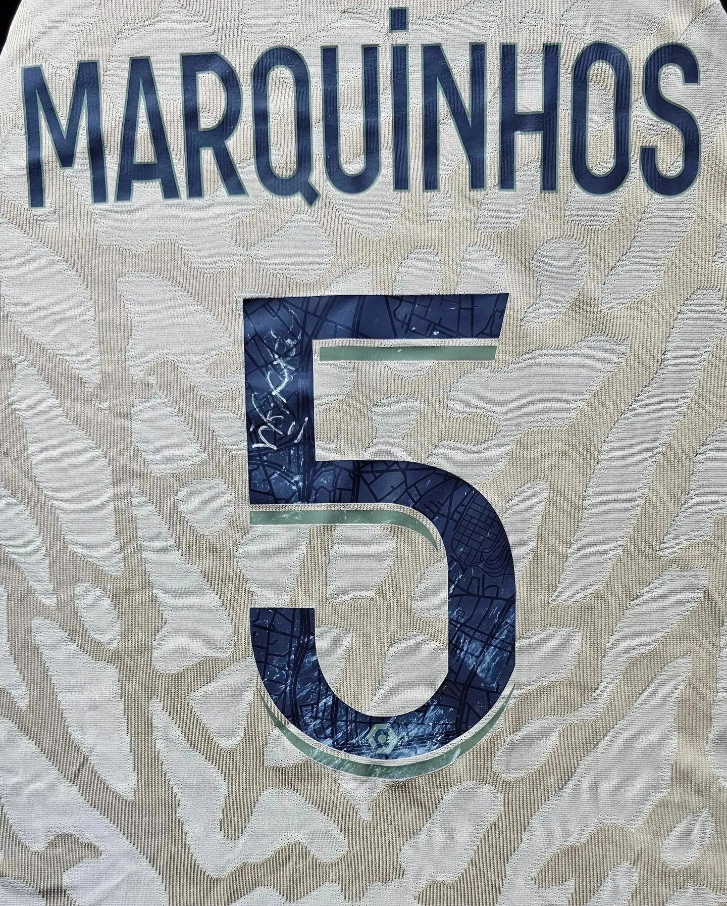 Back view showing Marquinhos name and No. 5 on the Paris Saint-Germain soccer jersey.