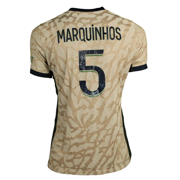 Back view of signed soccer jersey featuring MARQUINHOS and No. 5 on a camouflage design.