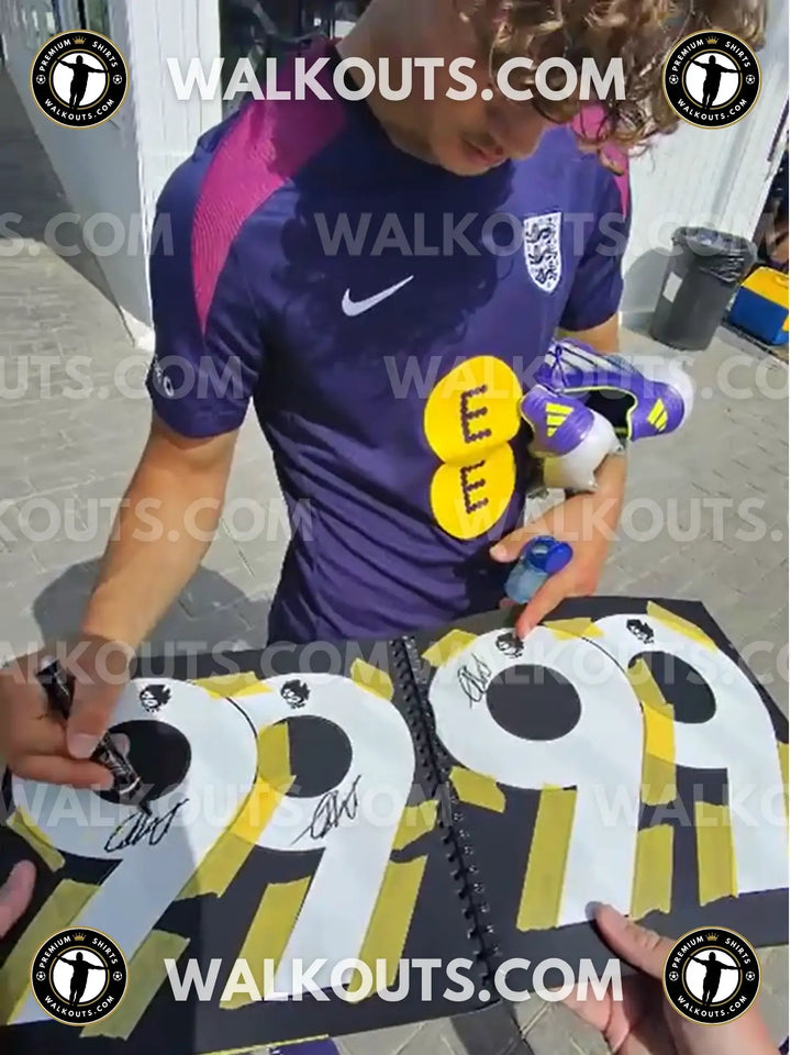 Front view of Max Dowman signed football shirt featuring No. 56 and visible Arsenal crest.
