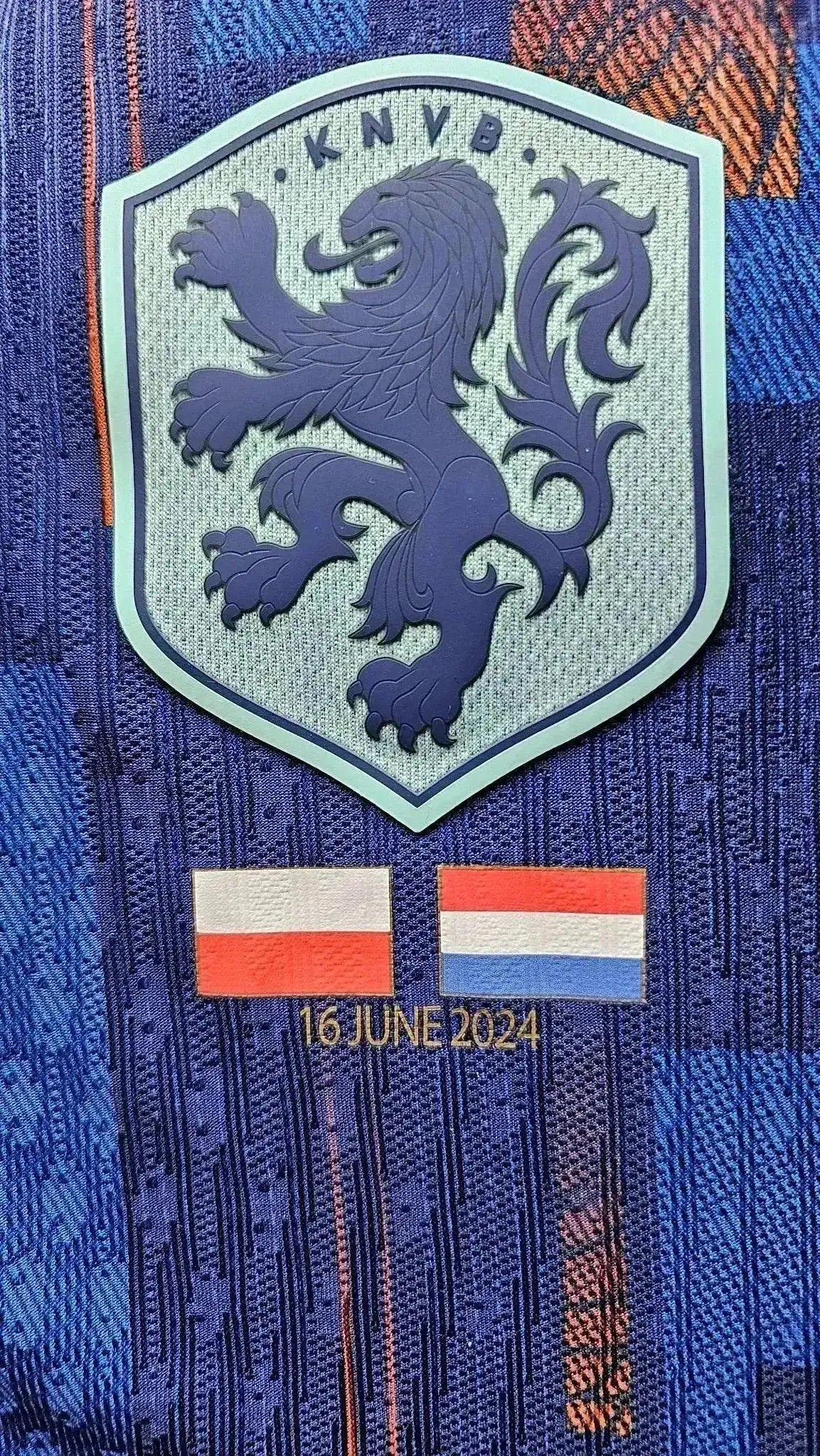 Crest detail featuring KNVB lion badge, Poland and Netherlands flags, and date 16 June 2024.