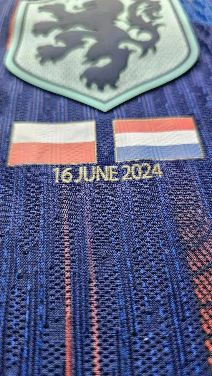 Crest detail showing the lion emblem and flags of Poland and Holland with the date 16 June 2024.