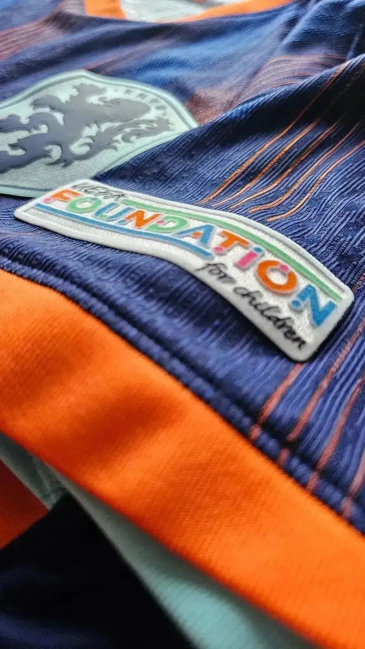 Crest detail featuring the UEFA Foundation for Children patch on the football shirt.