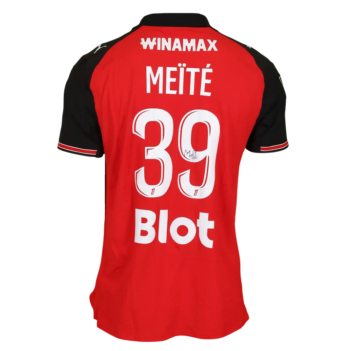 Back view of red and black Stade Rennes shirt, featuring MEÏTÉ, No. 39, and a visible signature.