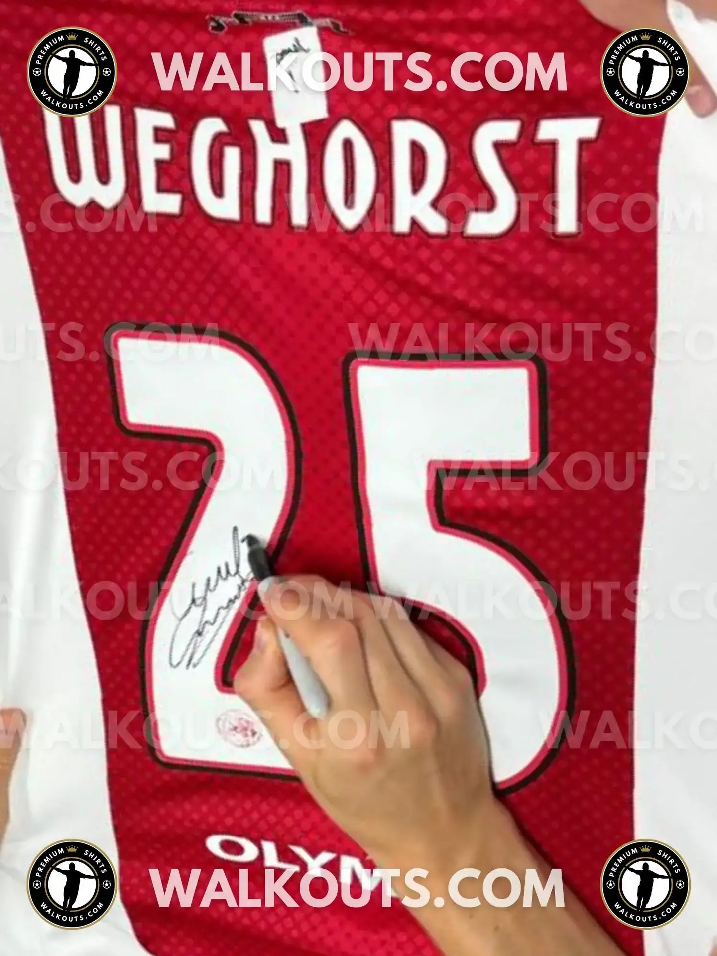Close-up of the No. 25 Ajax football shirt showing the signature of Weghorst.