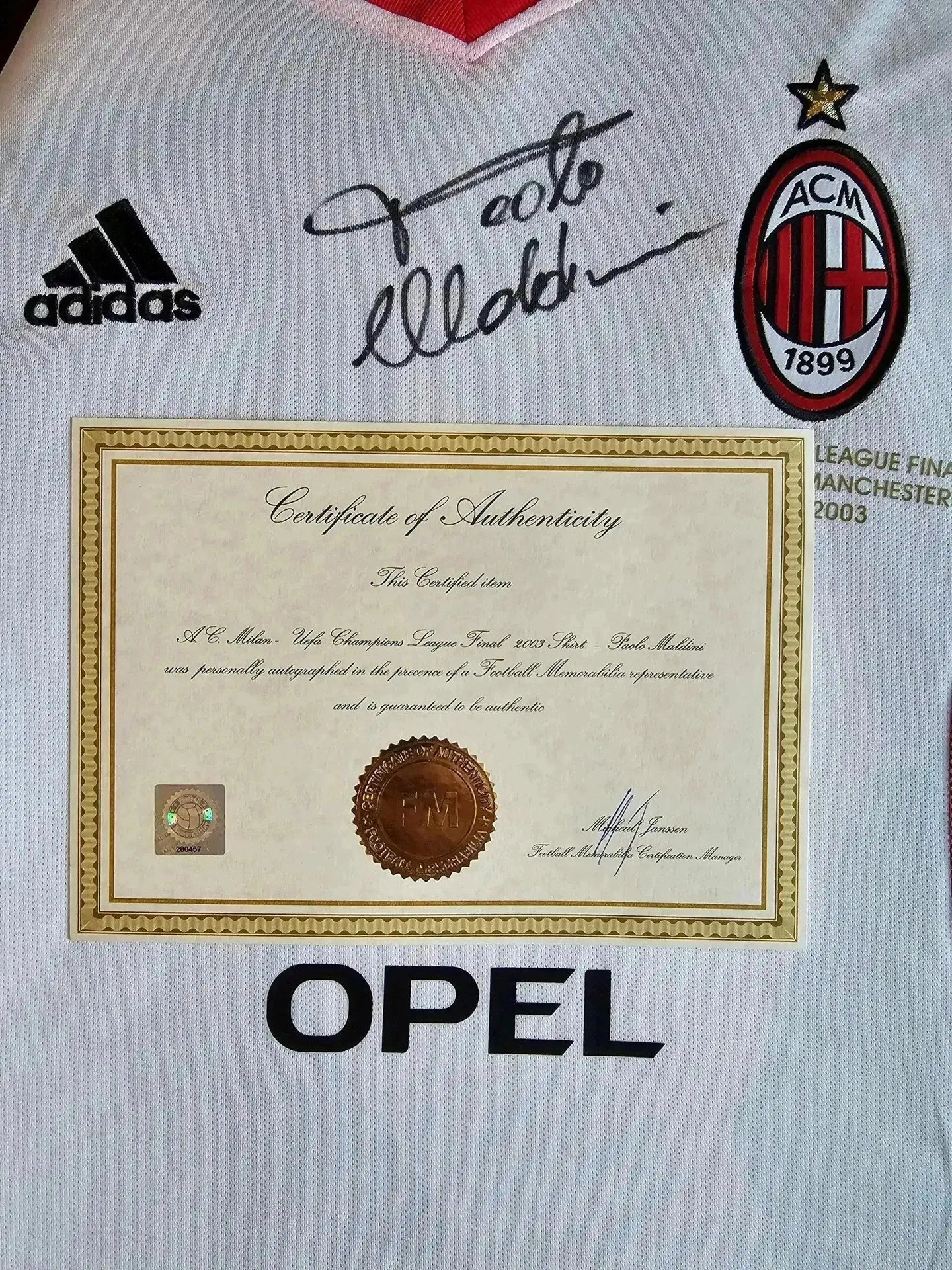 AC Milan football shirt with Paolo Maldini signature, adidas logo, and 'OPEL' sponsor text.