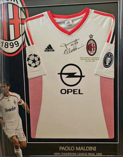 Front view featuring signed Paolo Maldini 3 AC Milan soccer jersey with sponsor Opel and UEFA crest.