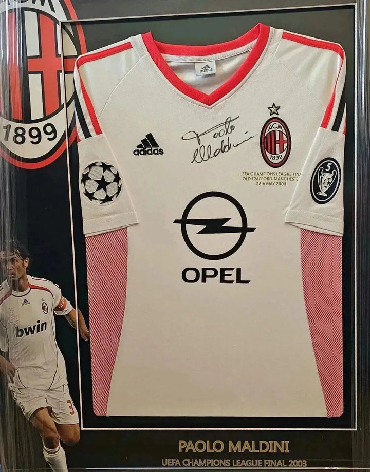Front view featuring signed Paolo Maldini 3 AC Milan soccer jersey with sponsor Opel and UEFA crest.