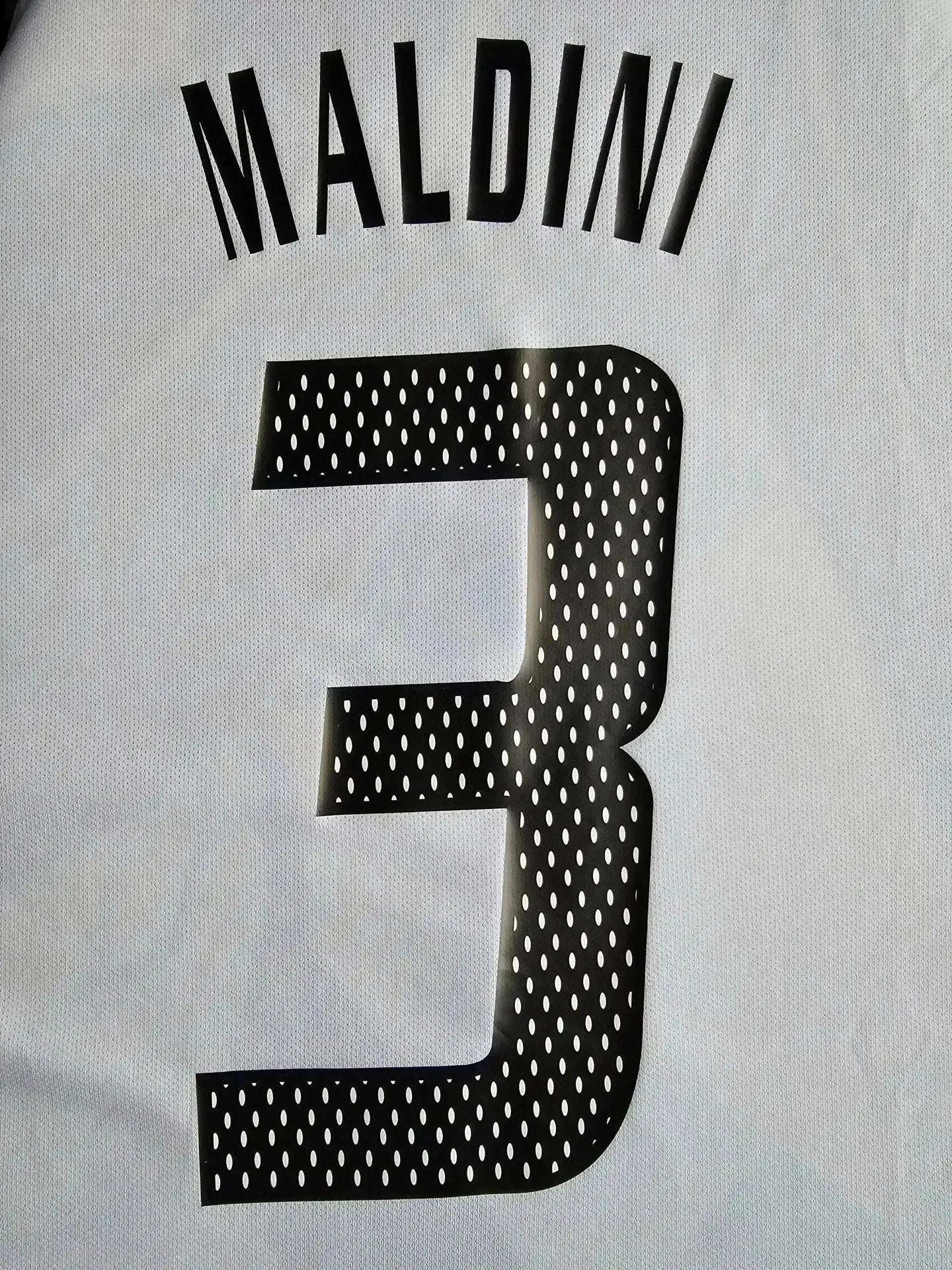 Back view showing player name Maldini and squad number 3 in black text.