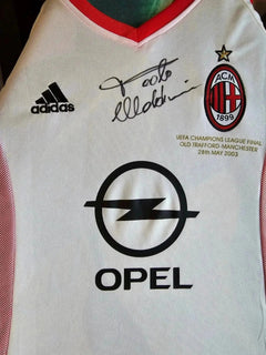 Detail view showing the signature of Paolo Maldini and the AC Milan crest with one star.