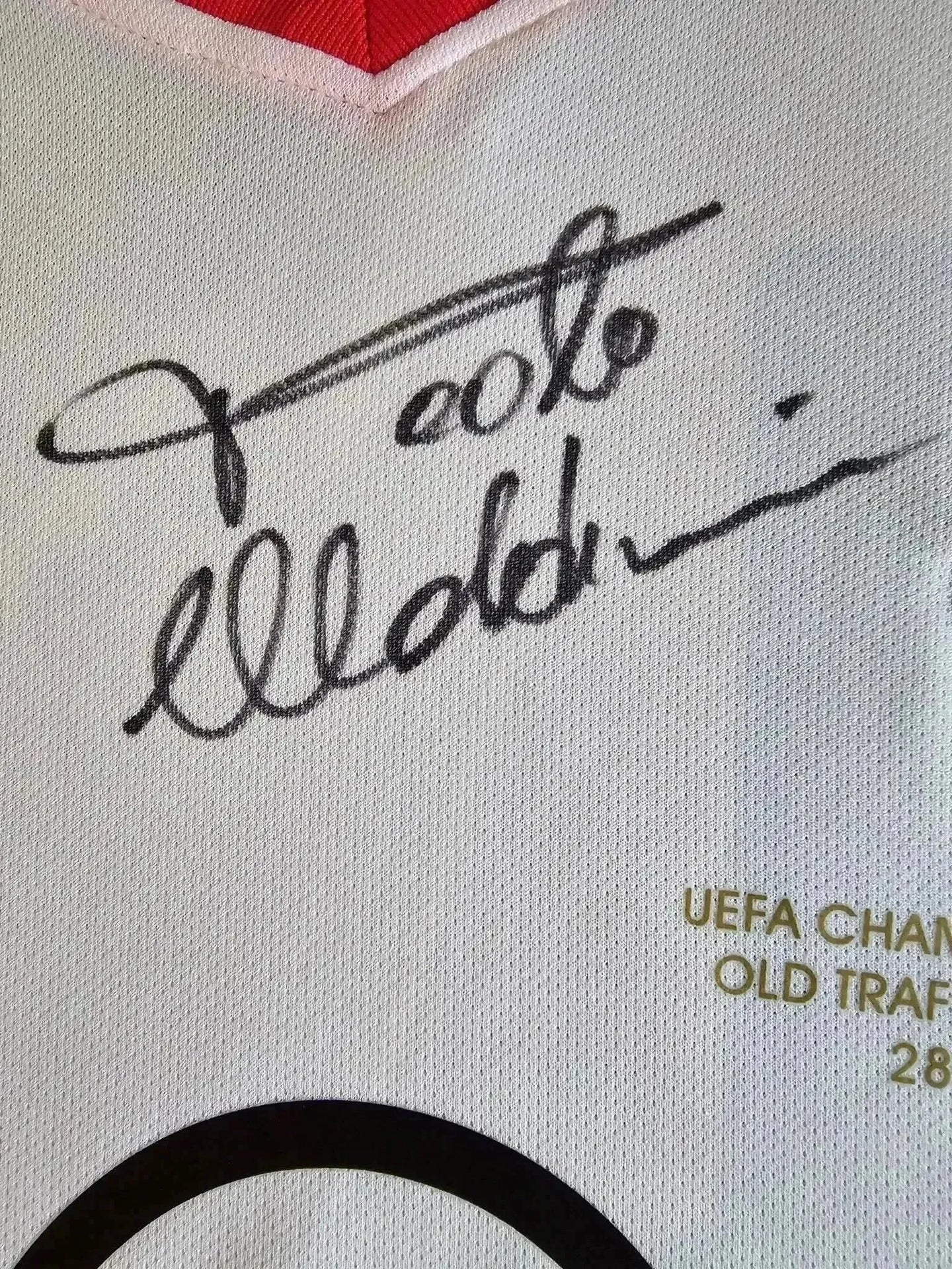 Signature of Paolo Maldini on the AC Milan 2002-2003 Home soccer jersey with UEFA Champions League detail.