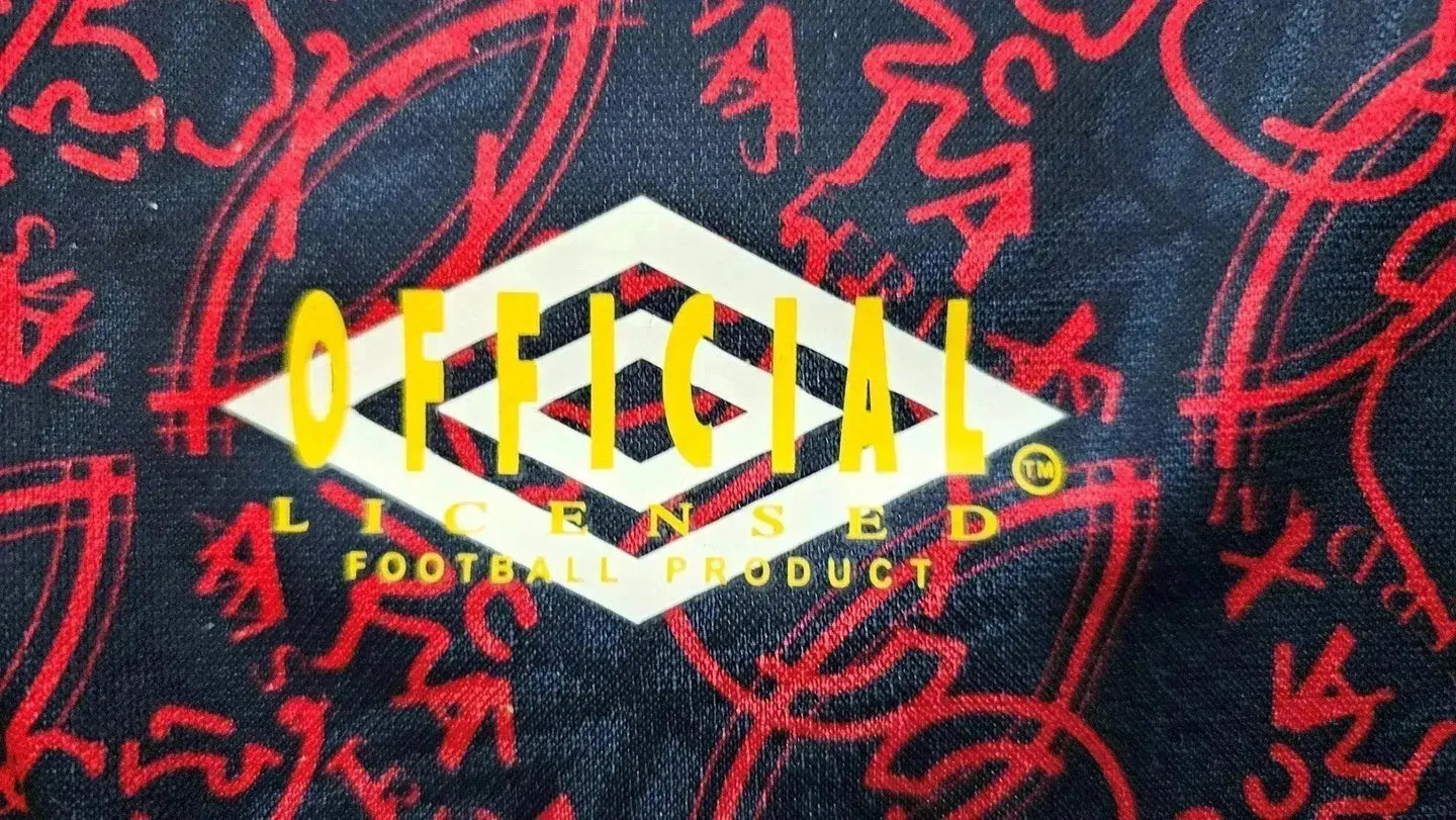 Detail view showing 'OFFICIAL LICENSED FOOTBALL PRODUCT' printed in yellow and white.
