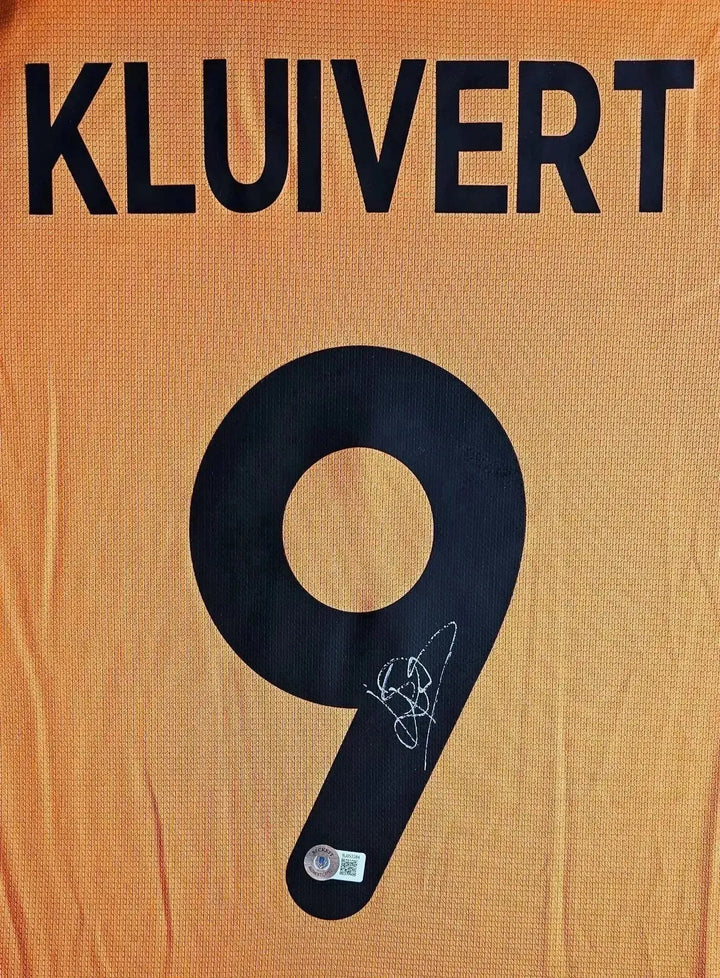 Detail view showing signature and No. 9 on the back of the signed football shirt for Kluivert.
