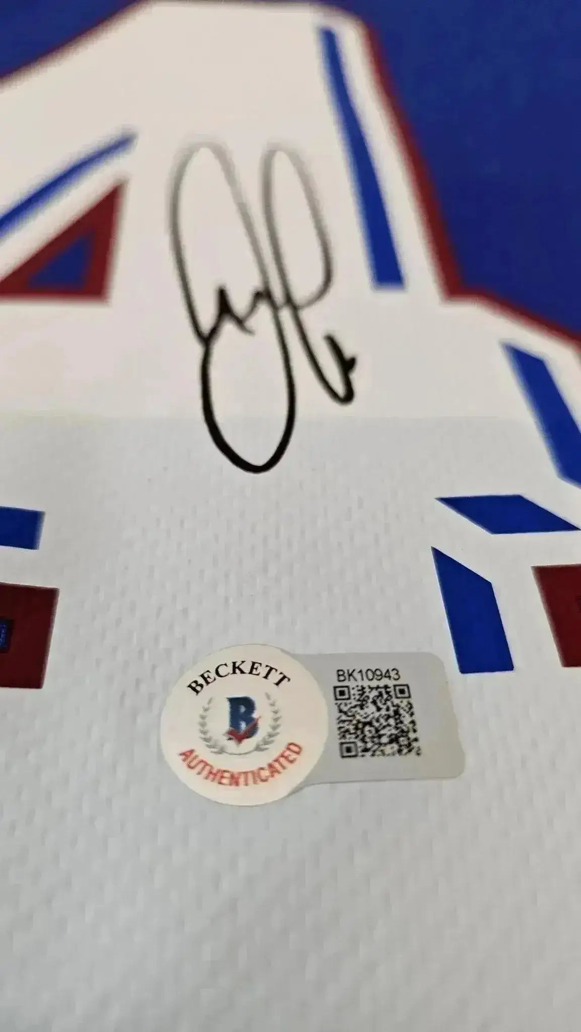 Signature detail of Patrick Vieira on the No. 4 of the France 1998 World Cup signed soccer jersey.