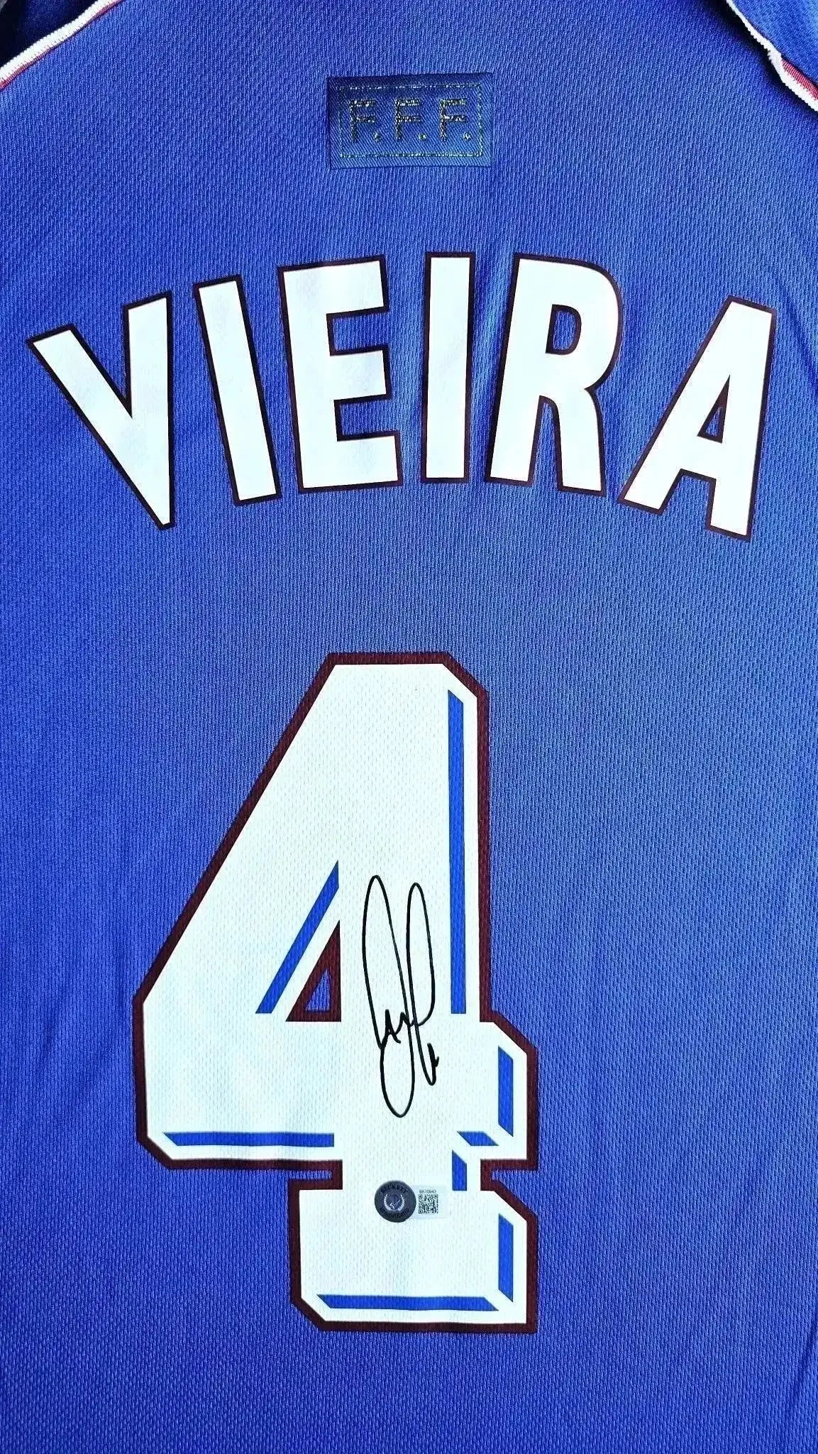 Back view showing Vieira, No. 4, and signature on blue France 1998 World Cup soccer jersey.
