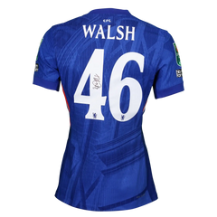 Back view featuring name WALSH, number 46, and signature of Reggie Walsh on blue football shirt.