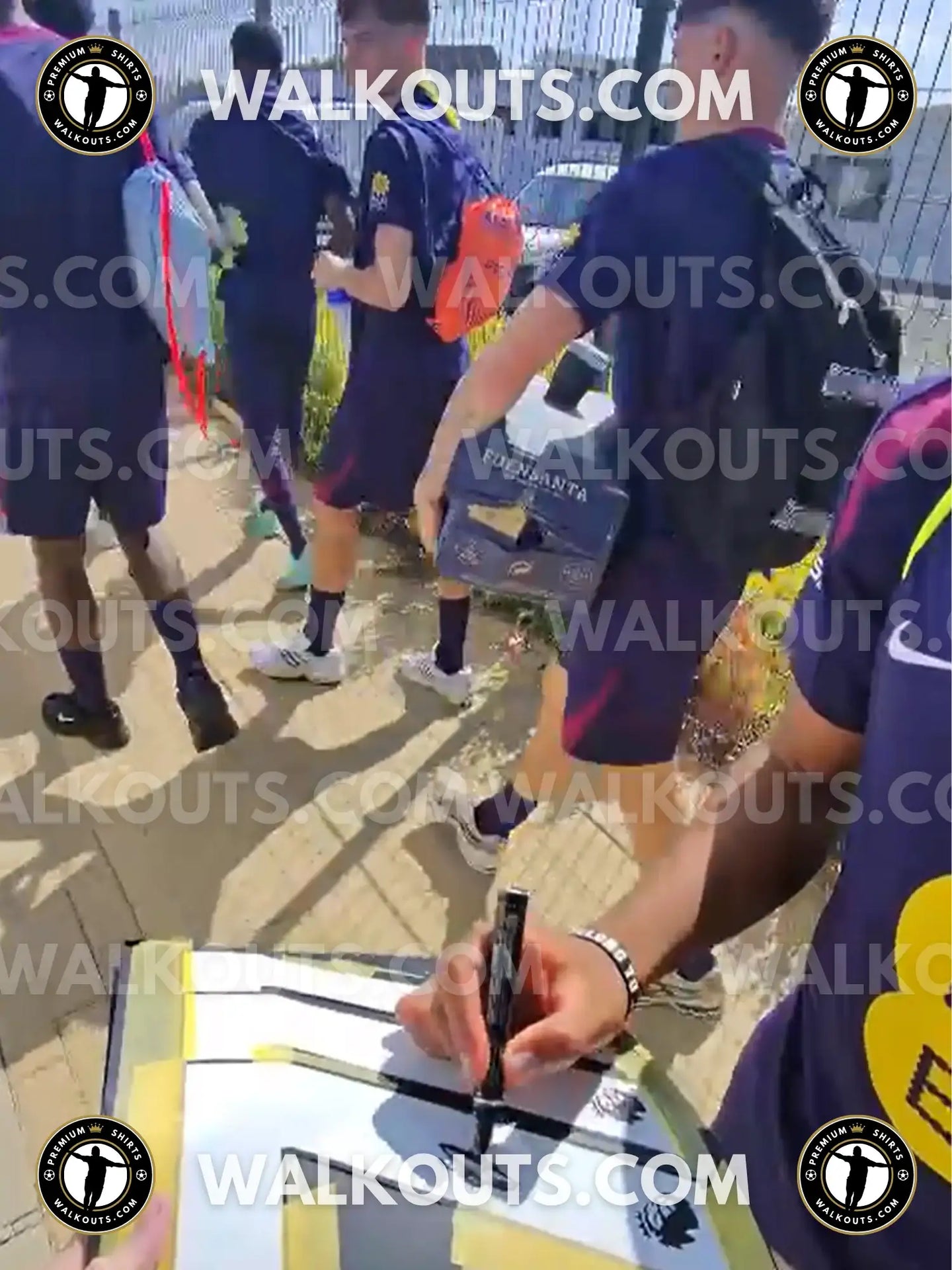 Signature detail of Rio Ngumoha on a Liverpool football shirt featuring red and yellow accents.