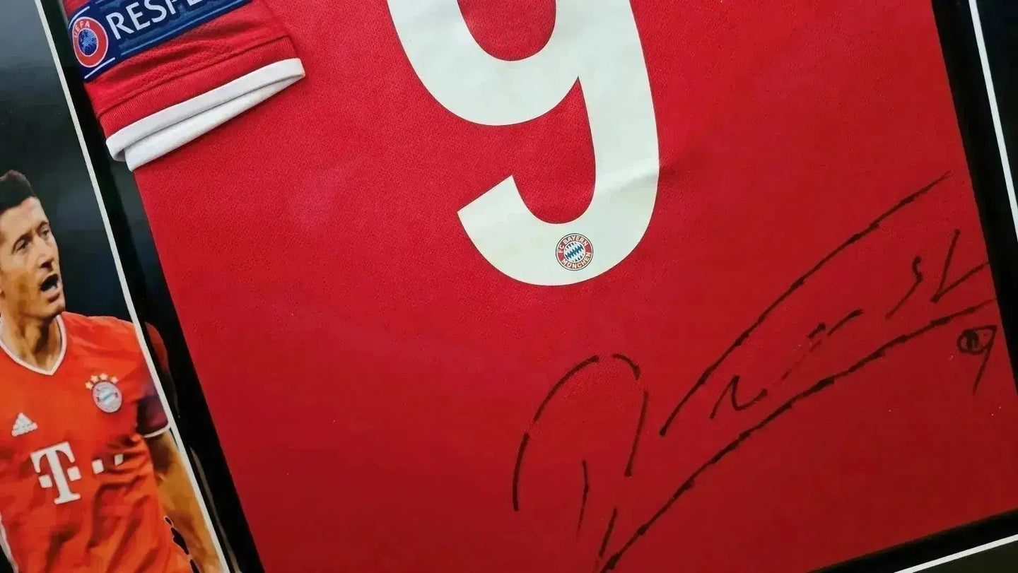 Front view showing No. 9 and signature on red soccer jersey with Bayern Munich crest.