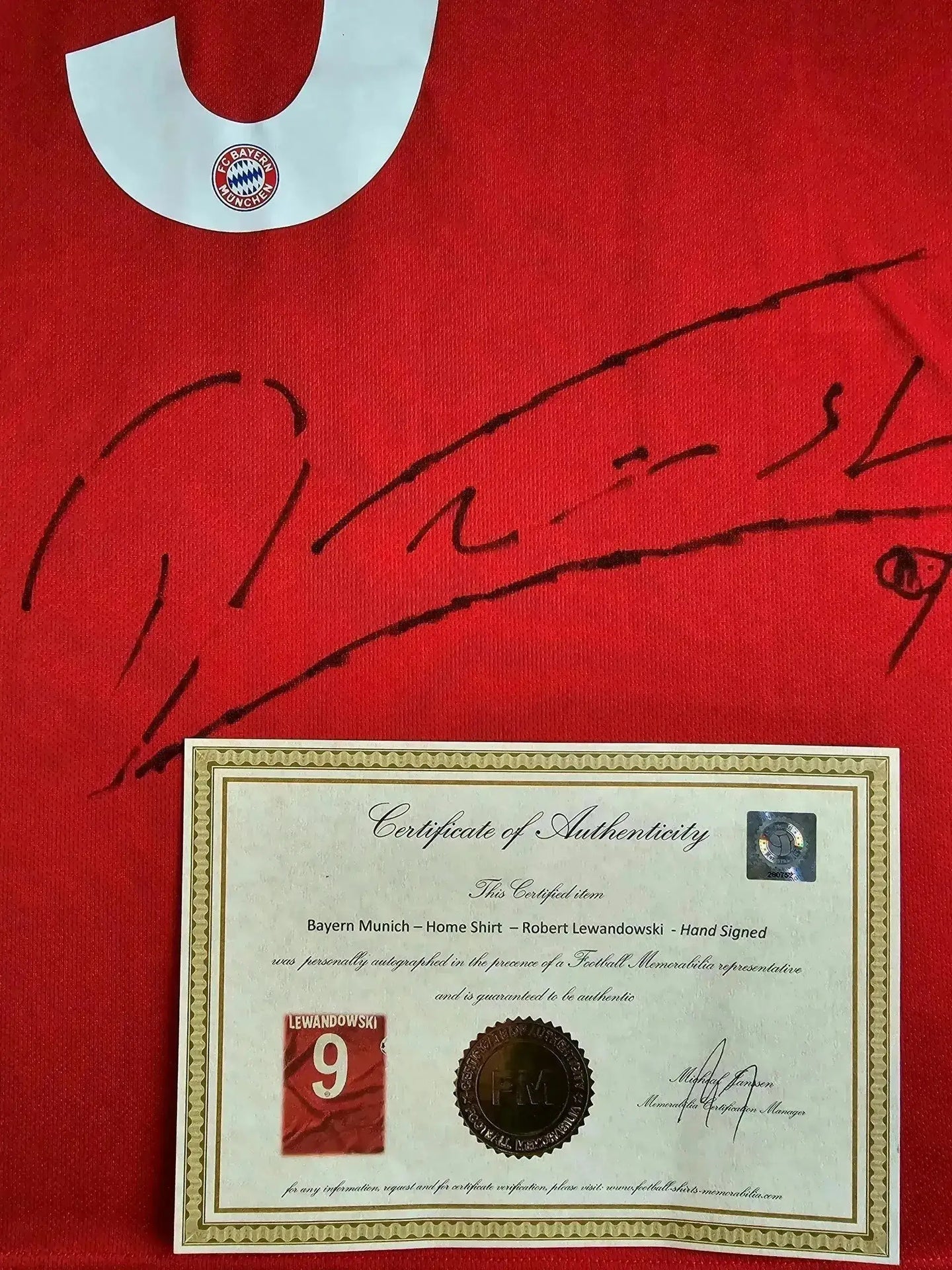 Front view of Robert Lewandowski 9 on a red FC Bayern Munich signed soccer jersey with certificate.