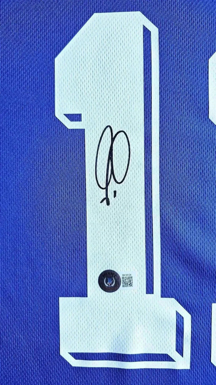 Detail view featuring signature and No. 7 on Robert Pires' France 1998 World Cup football shirt.