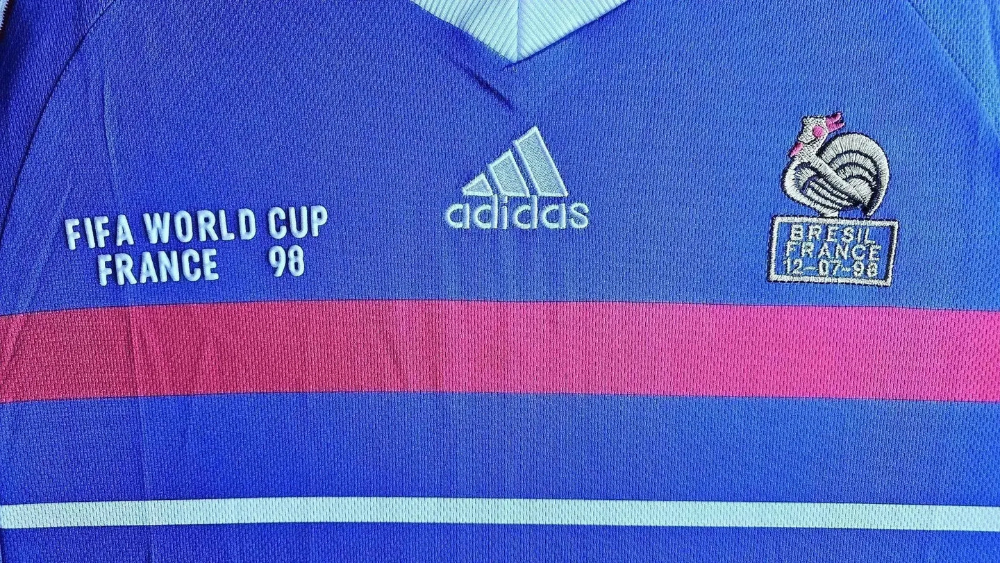 Detail view showing FIFA WORLD CUP FRANCE 98, adidas logo, and embroidered crest with date.