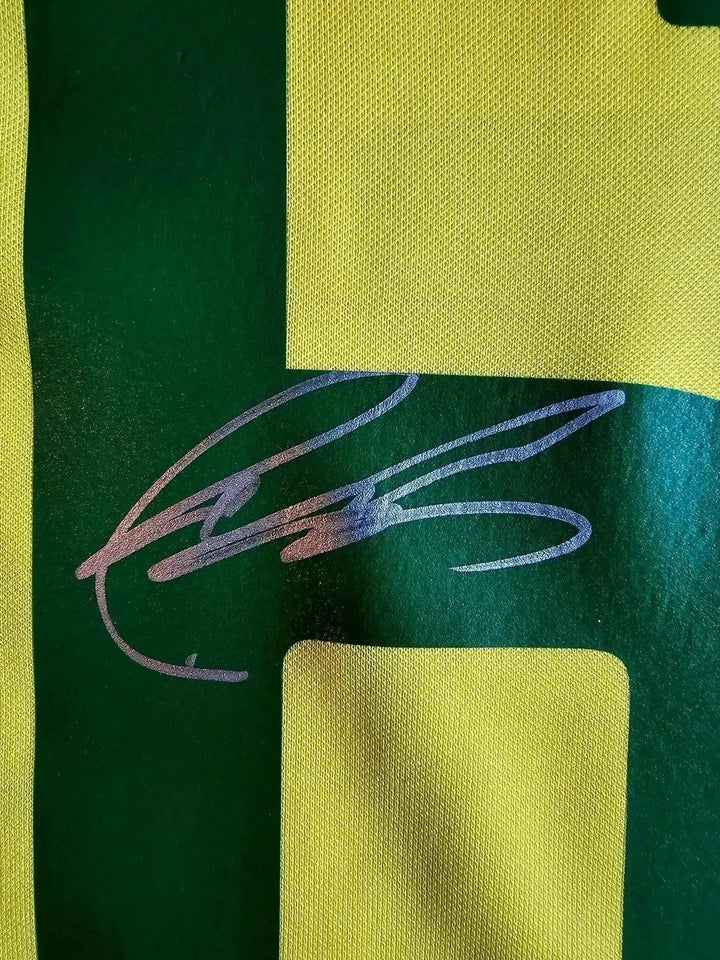 Close-up view showing signature detail on the Brazil 2002 World Cup soccer jersey.