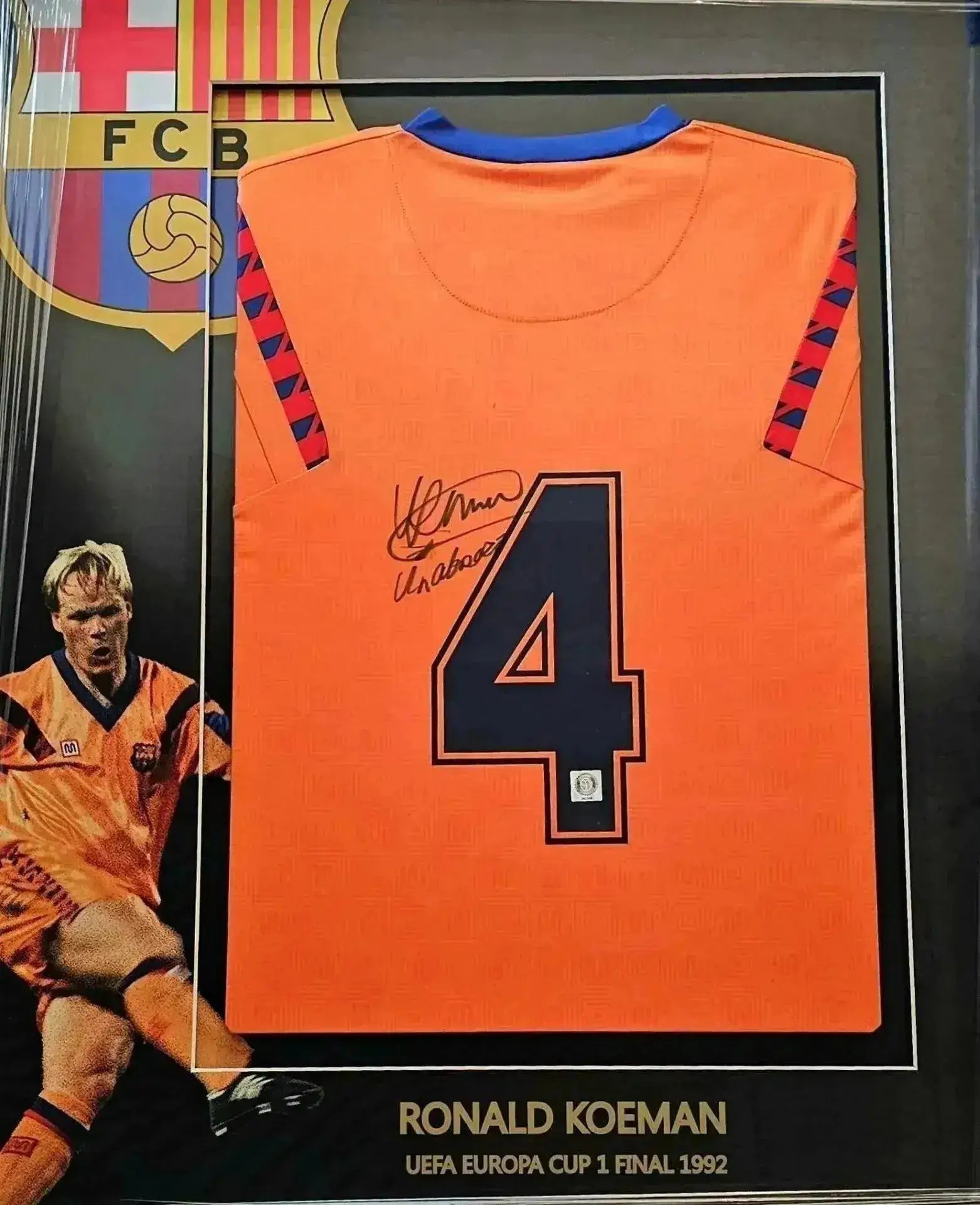 Back view showing orange football shirt with No. 4 and Ronald Koeman's signature.