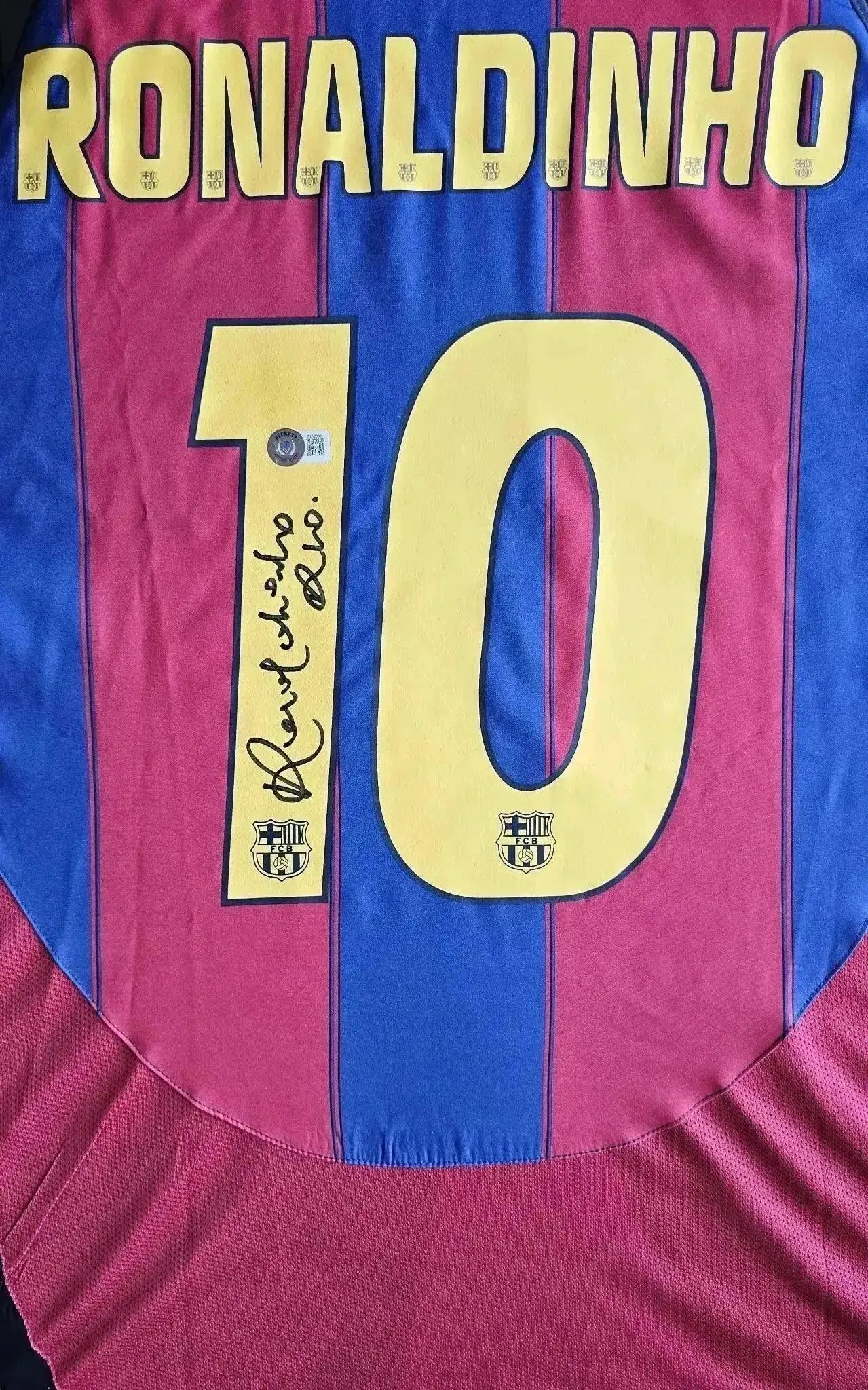 Back view with Ronaldinho, No. 10, and signature on a Barcelona soccer jersey.