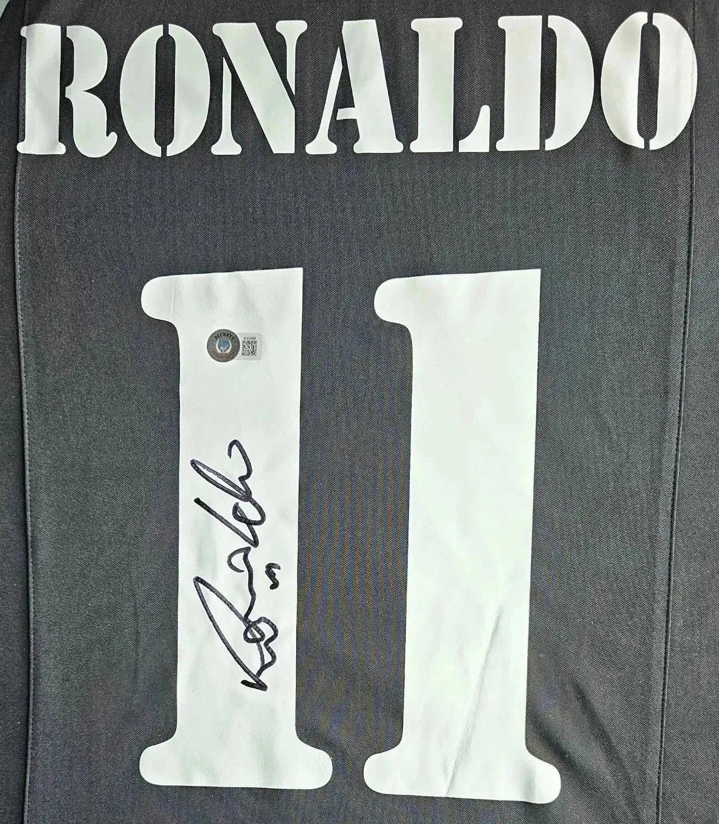 Back view showing RONALDO, No. 11, with a visible signature in black ink.