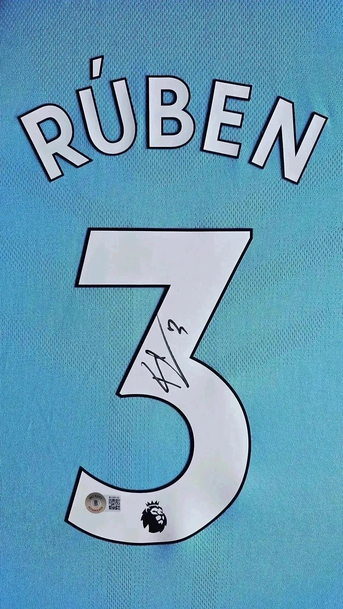 Detail view showing RÚBEN and No. 3, with a visible signature underneath.