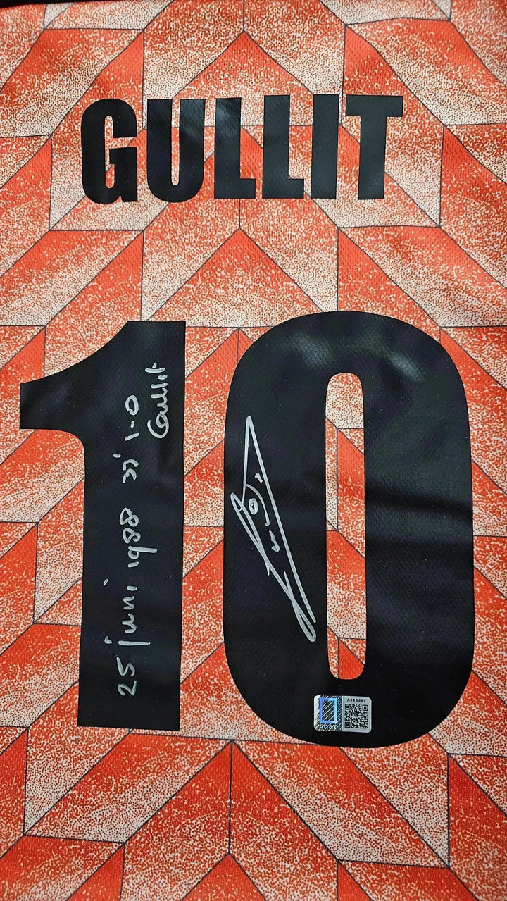 Detail showing the name GULLIT, No. 10, and a signature, alongside date markings on a signed football shirt.