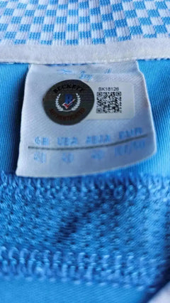 Beckett certification and size label on the Sergio Agüero signed Manchester City soccer jersey.