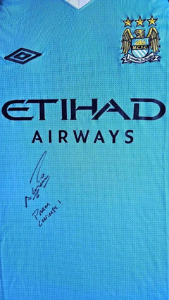 Front view showing Manchester City crest and signature from Sergio Agüero, with ETIHAD AIRWAYS sponsor.