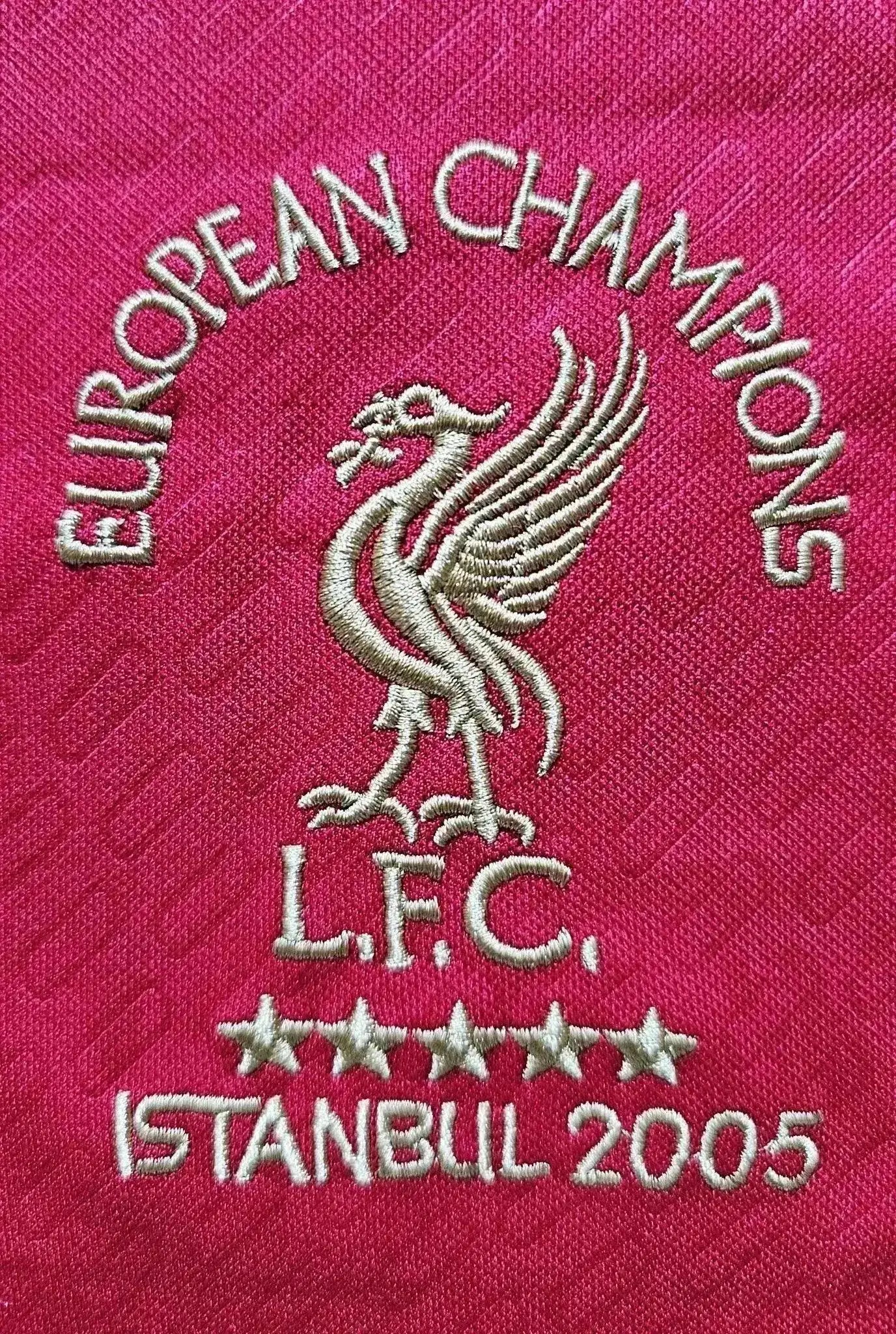 Crest detail featuring Liverpool F.C. emblem, five stars, and "EUROPEAN CHAMPIONS ISTANBUL 2005".