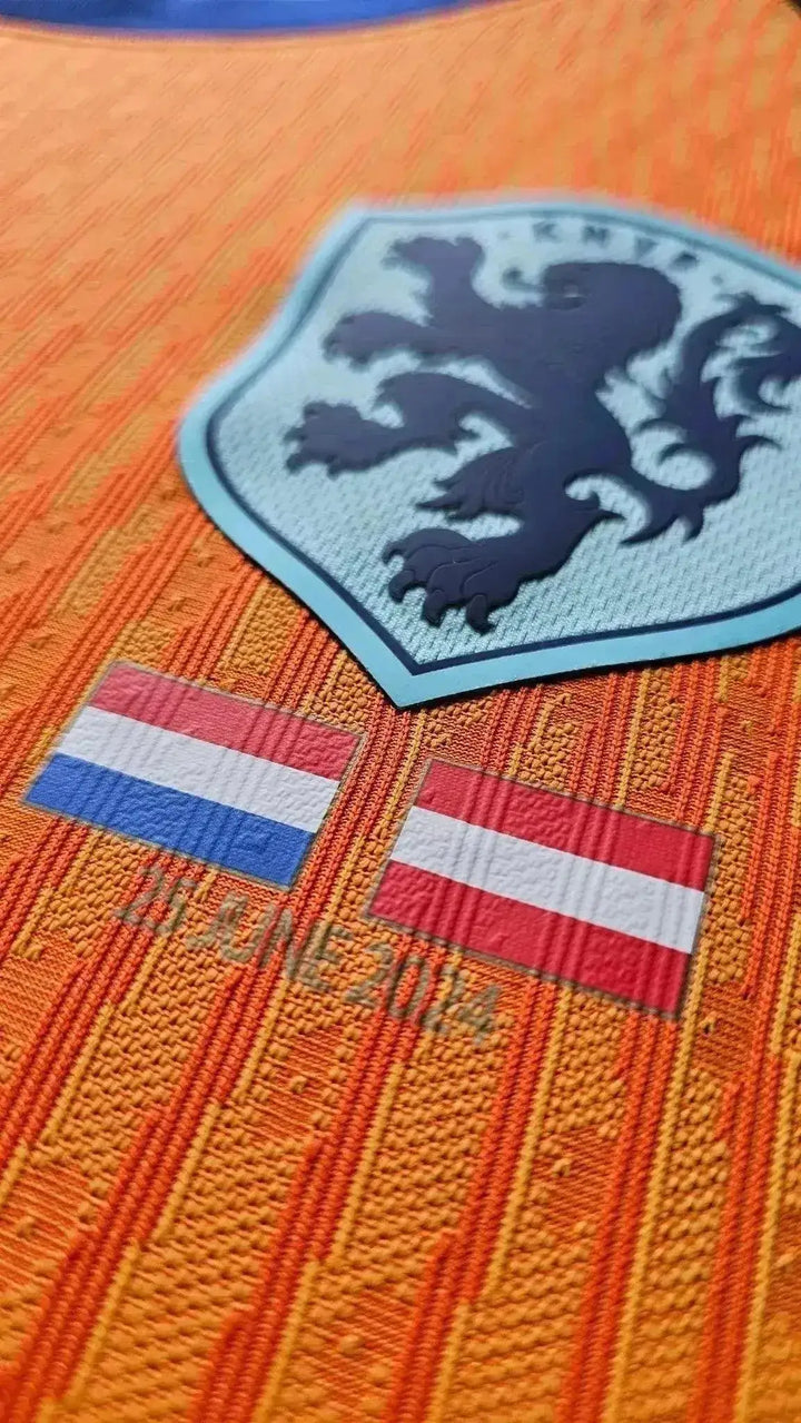 Close-up of the crest featuring a lion and two flags of Netherlands and Austria with an orange background.