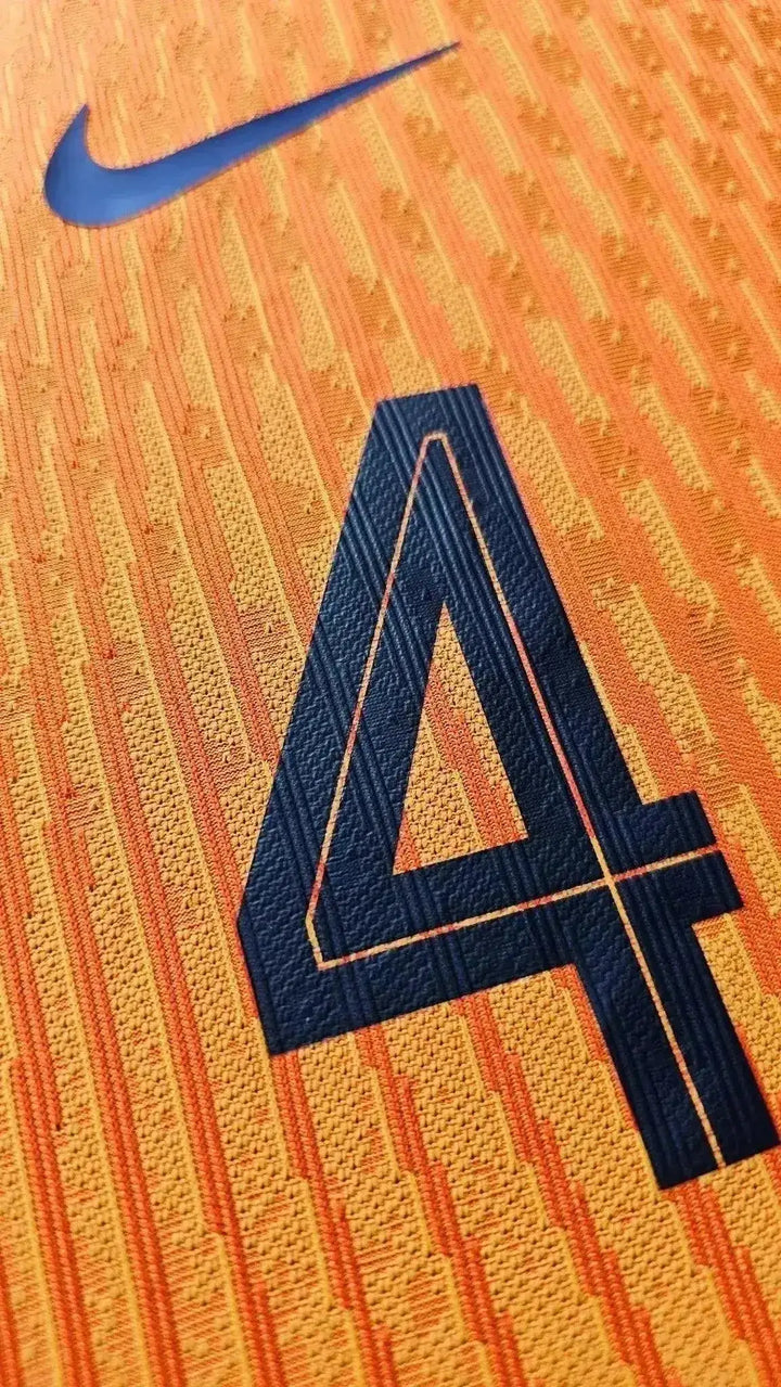 Close-up view highlighting the No. 4 and Nike logo on the orange Holland shirt.