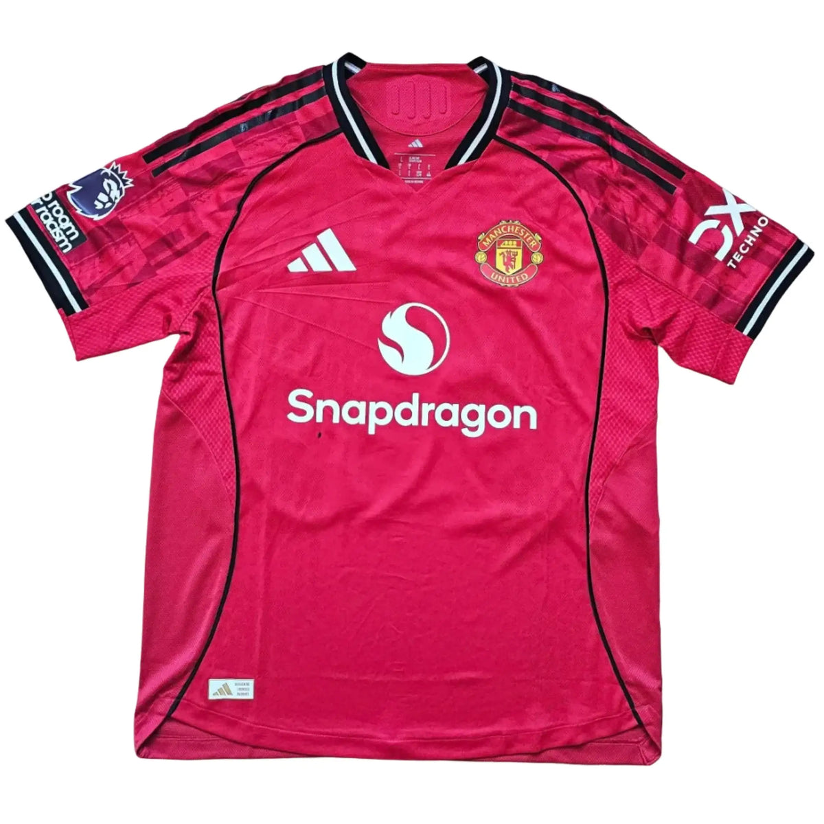 Front view of Bendito Mantato's red Manchester United F.C. shirt laid flat, adidas logo, club crest and Snapdragon sponsor text, No. 70, 2025-2026.