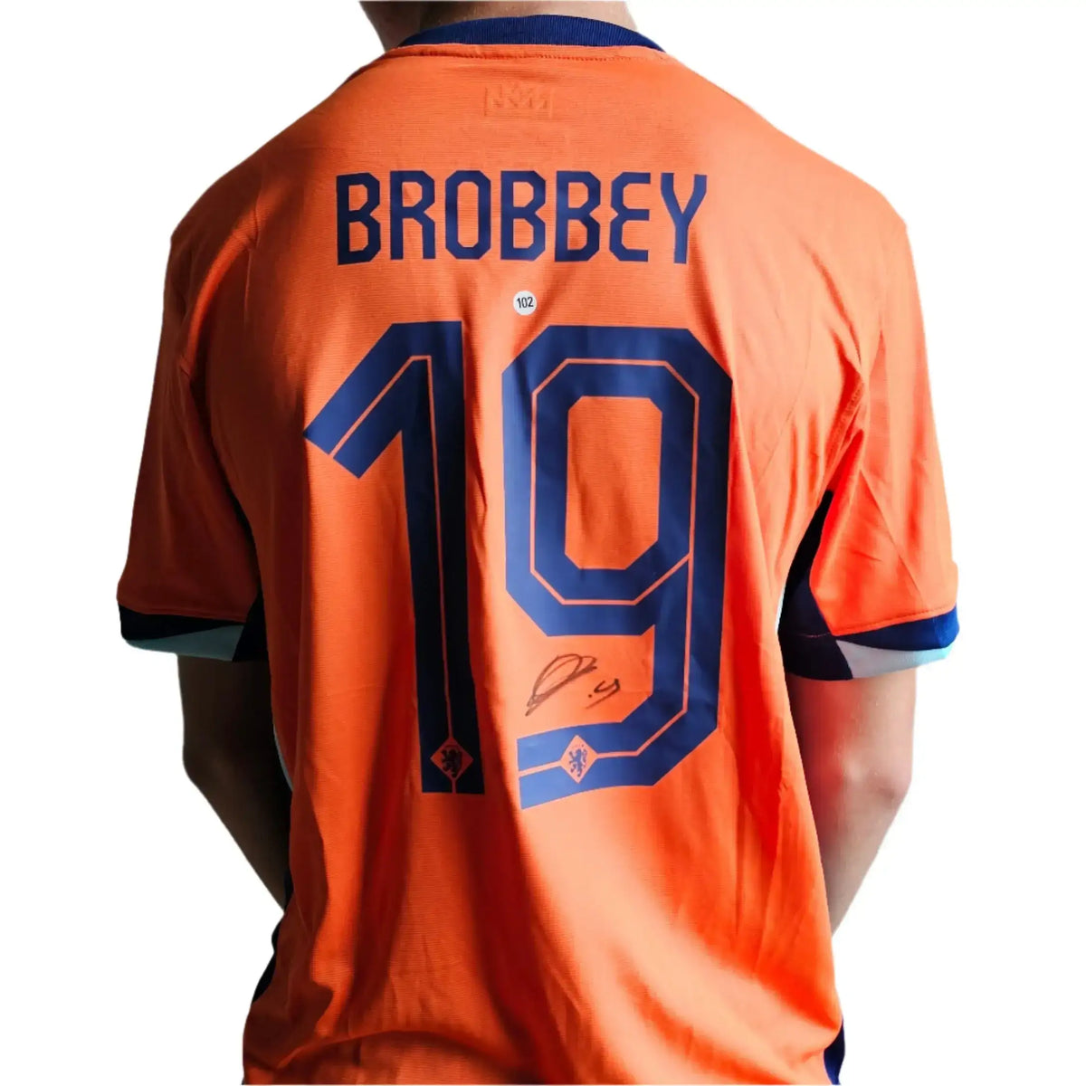 BROBBEY printed above a signed number 19 on the back of an orange Netherlands shirt, next to the navy KNVB lion crest, from Brian Brobbey's Euro 2024 shirt.