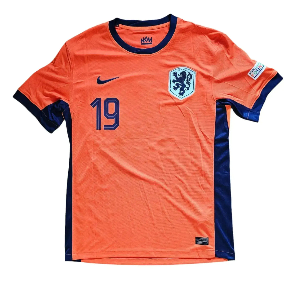 Front of an orange Netherlands home shirt with navy trim, Nike swoosh, KNVB lion crest, and printed number 19; Brian Brobbey, Holland Euro 2024.