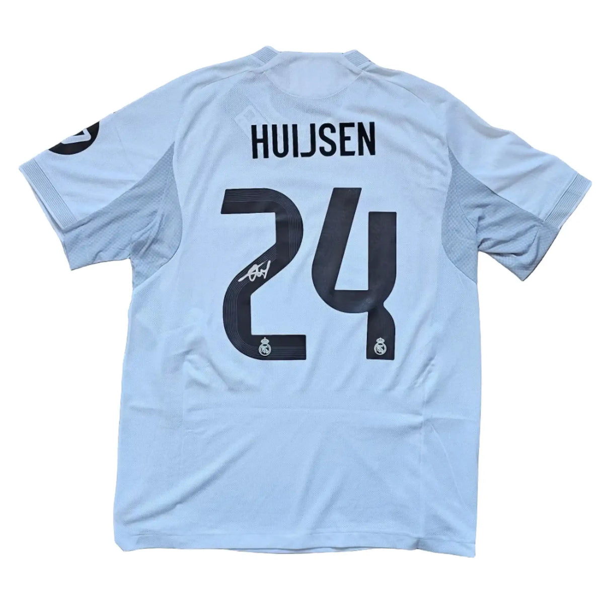 Back view featuring Huijsen, No. 24, and a visible signature.
