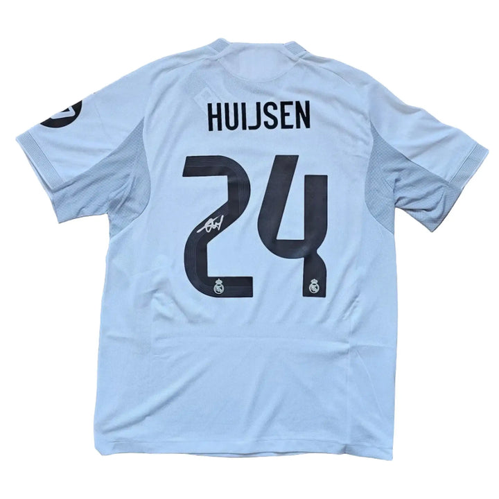 Back view featuring Huijsen, No. 24, and a visible signature.