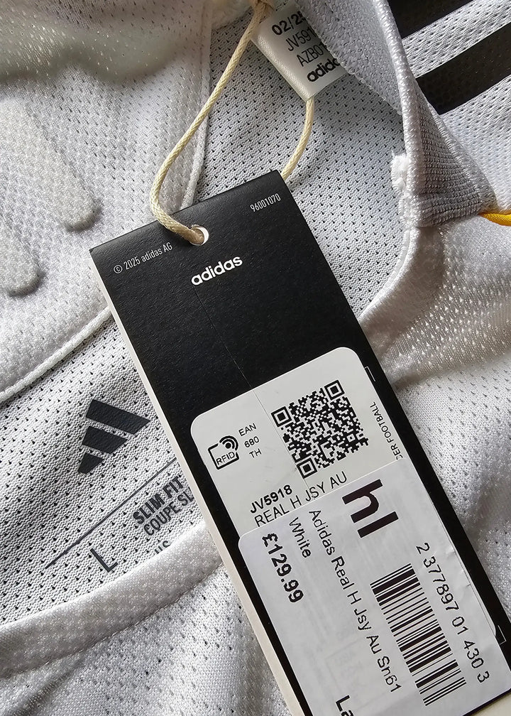 Close-up of the hang tags on the Real Madrid shirt, including the adidas barcode tag and size label.