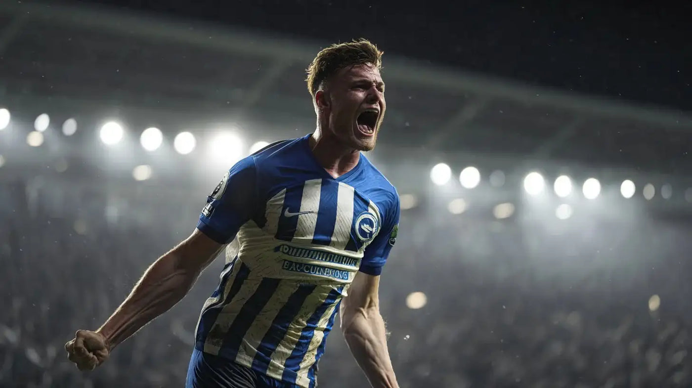Evan Ferguson celebrating in Brighton & Hove Albion striped football shirt under bright floodlights.