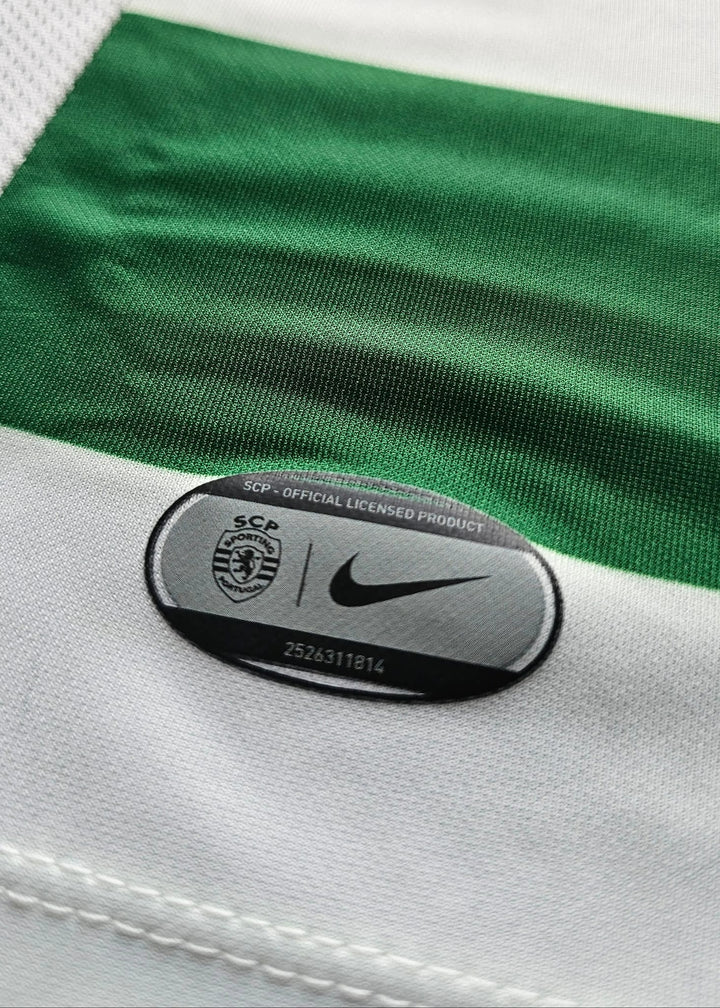 Close-up of a green and white striped athletic jersey with a black oval Nike patch reading 'SCA Official Licensed Product' on the white fabric.